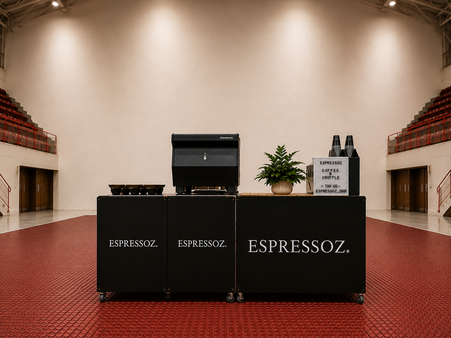 Espressoz mobile coffee bar set up across three black units with an espresso machine, prep counter and branded trolley