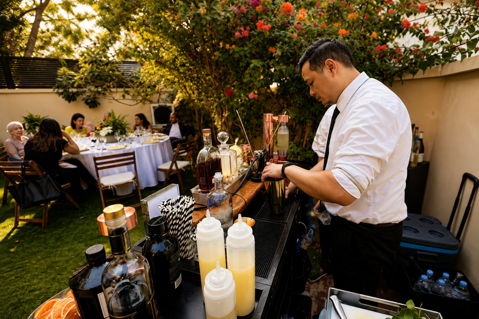 Ounce bartender preparing drinks at an intimate dinner