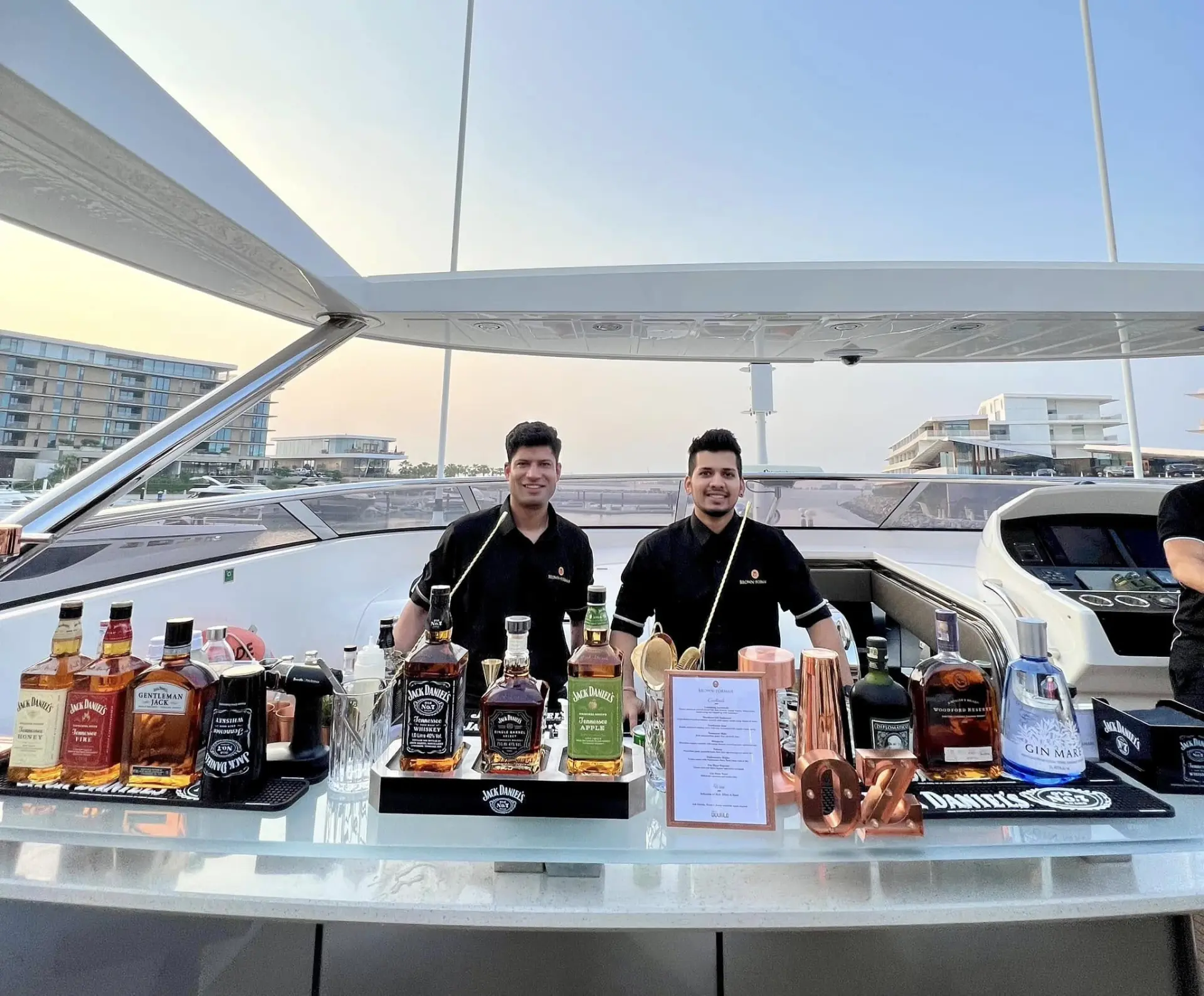 Ounce bartenders serving on a private yacht charter